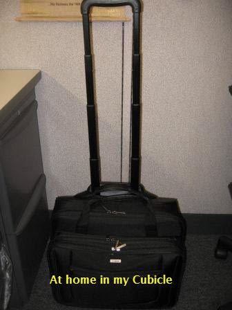 Rolling laptop case in cubicle