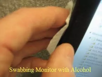 before affixing monitor mirror I am swabbing monitor with alcohol