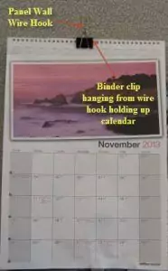 Hanging a calendar with a panel wall wire Hook and a binder clip