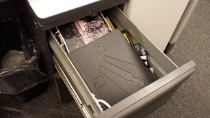 Cubicle drawer before decluttering