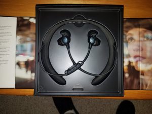 Box opened up revealing neckband and earbuds
