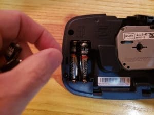 Inserting batteries into label maker