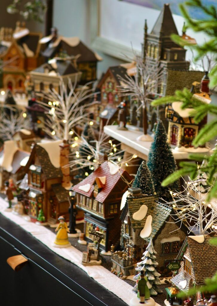 A display of christmas village decorations on a table