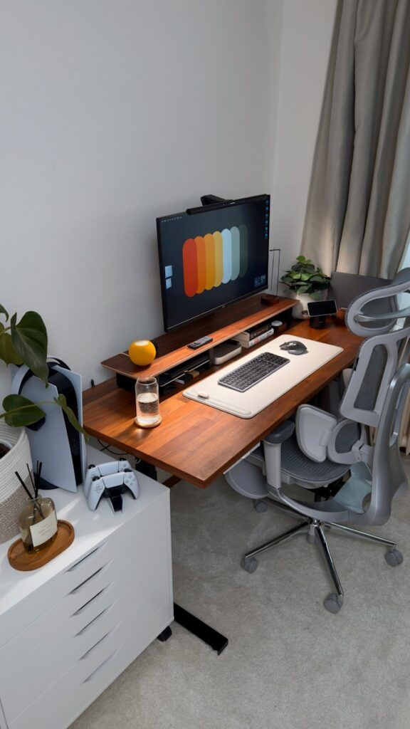 A modern desk setup with computer and gaming accessories.