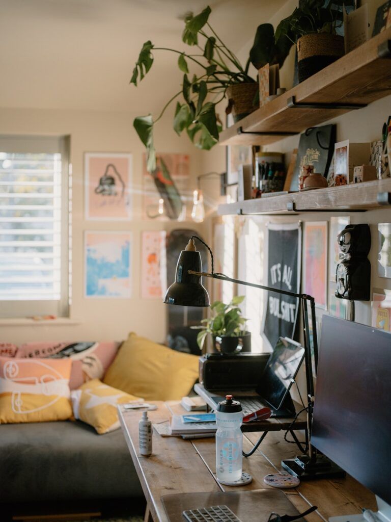 Cozy home office with plants and artwork