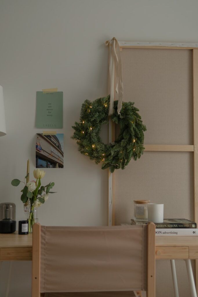 a wreath on a wall next to a chair
