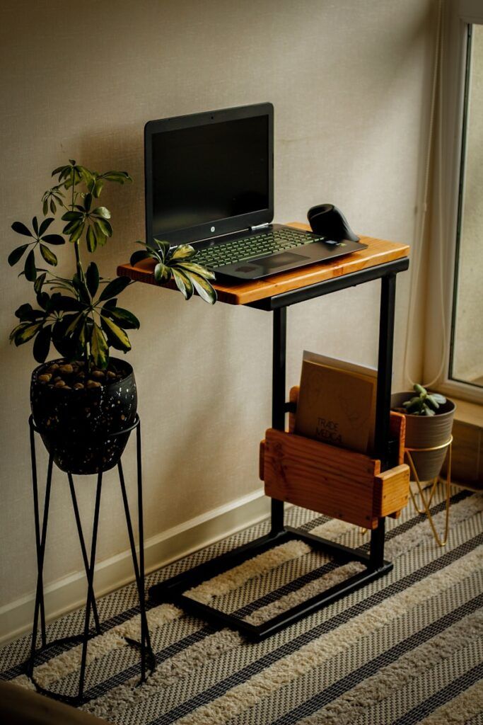 a laptop on a laptop stand desk