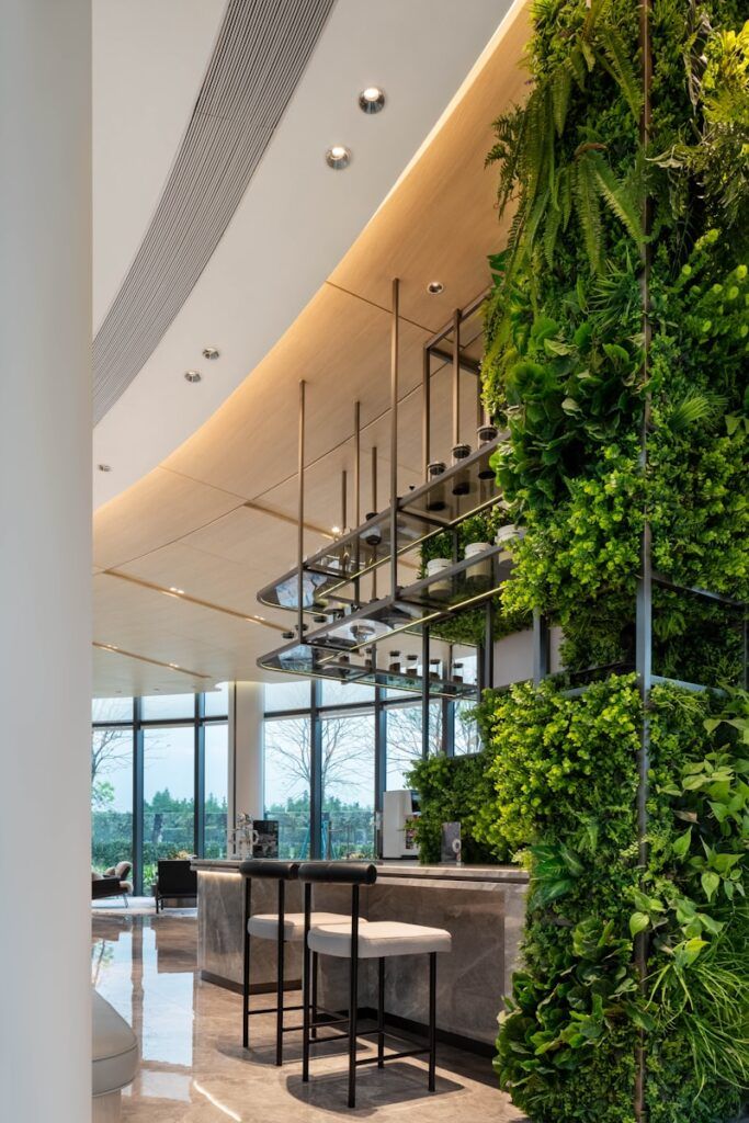 Modern corporate interior with vertical garden and hanging plants