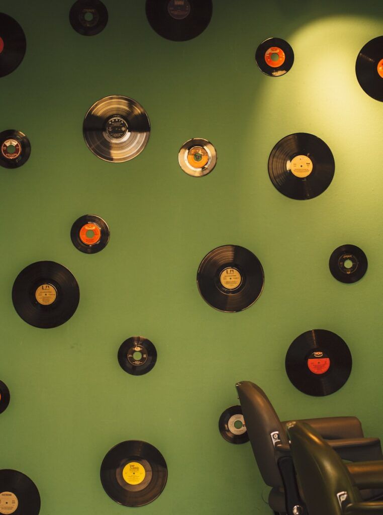 A room with a lot of records on the wall