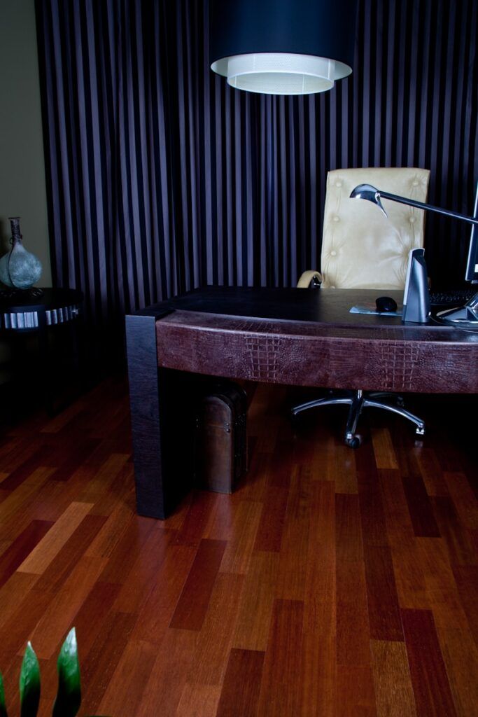 A desk with a lamp on top of it