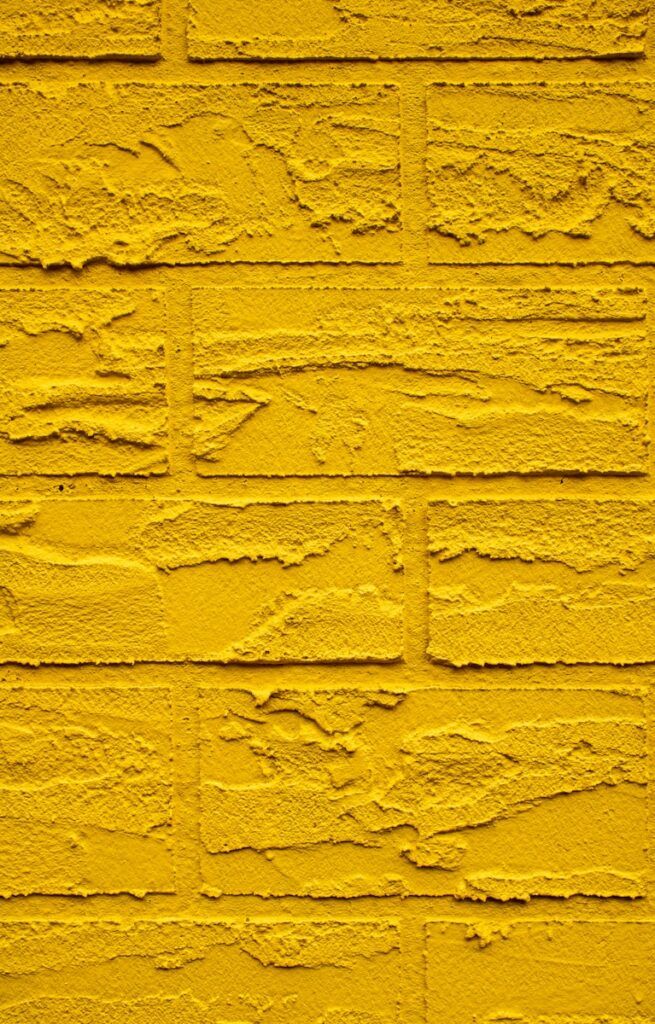mustard brick wall texture.