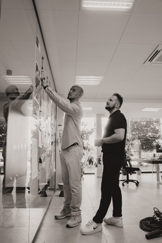 A couple of men standing next to each other