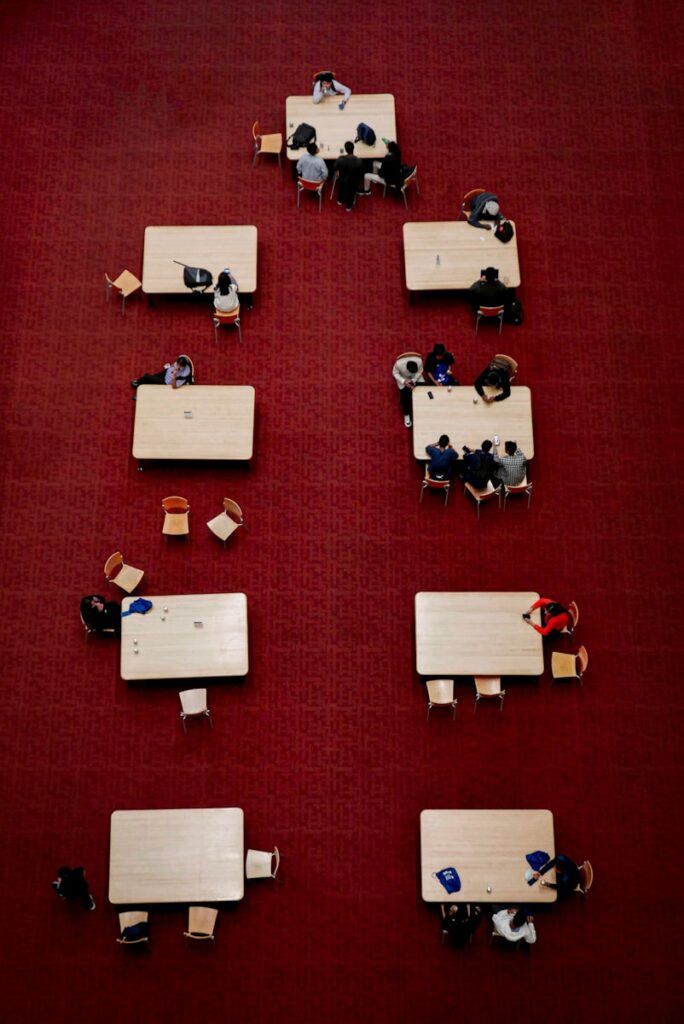 a group of people sitting at tables in a room