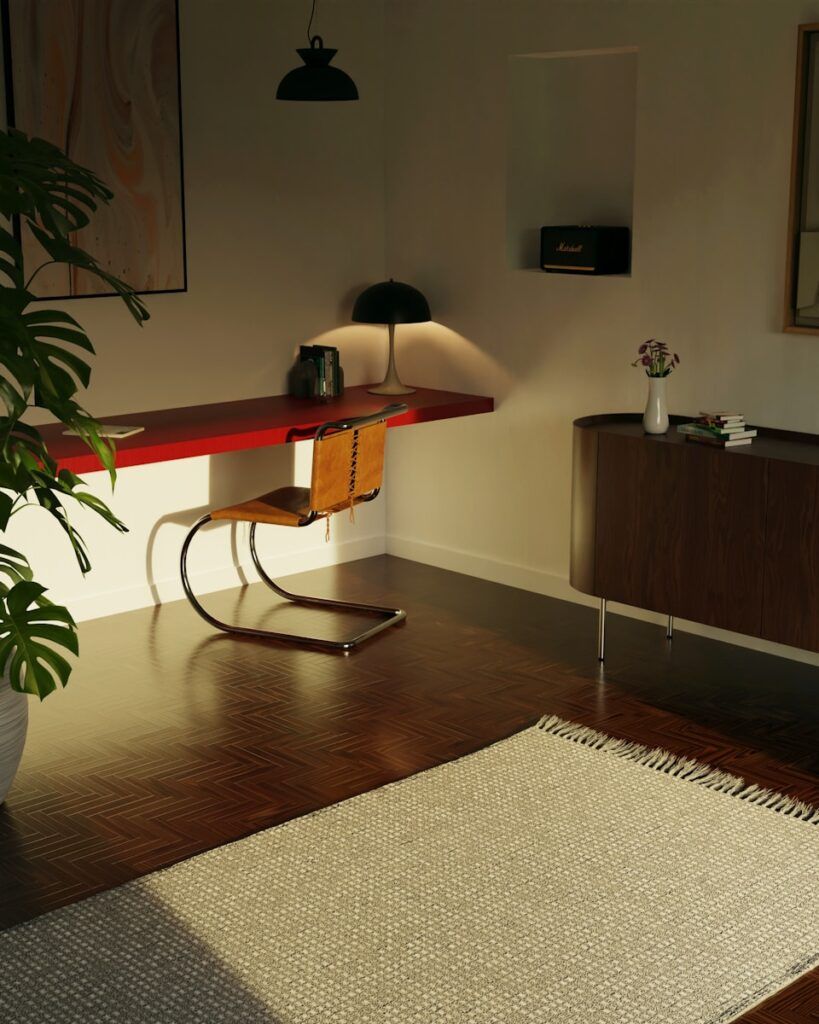 a linear office with a rug and a table