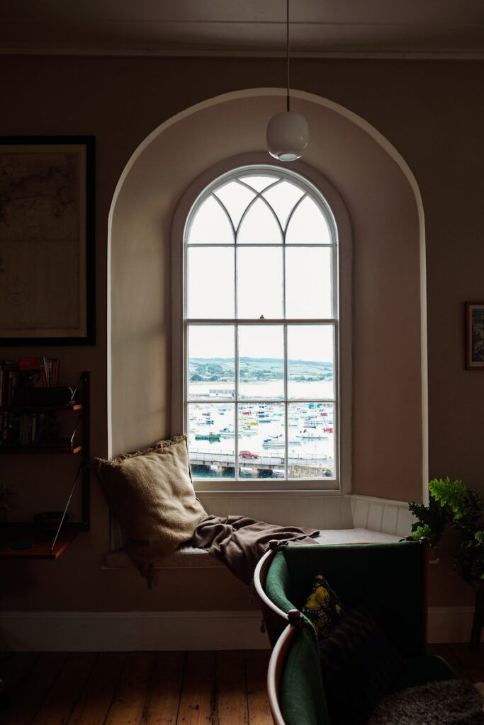 Cozy window seat with a beautiful harbor view.