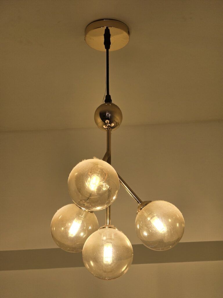 A chandelier hanging from a ceiling in a room