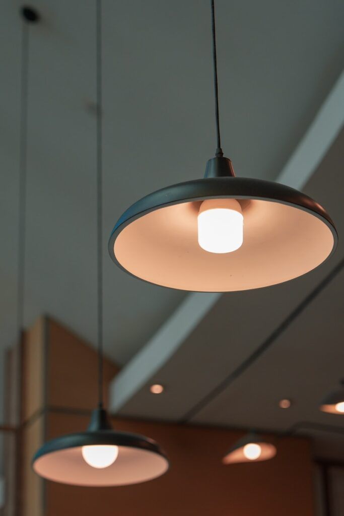 A couple of lights hanging from a ceiling