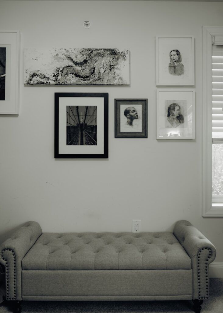 A living room with a couch and pictures on the wall