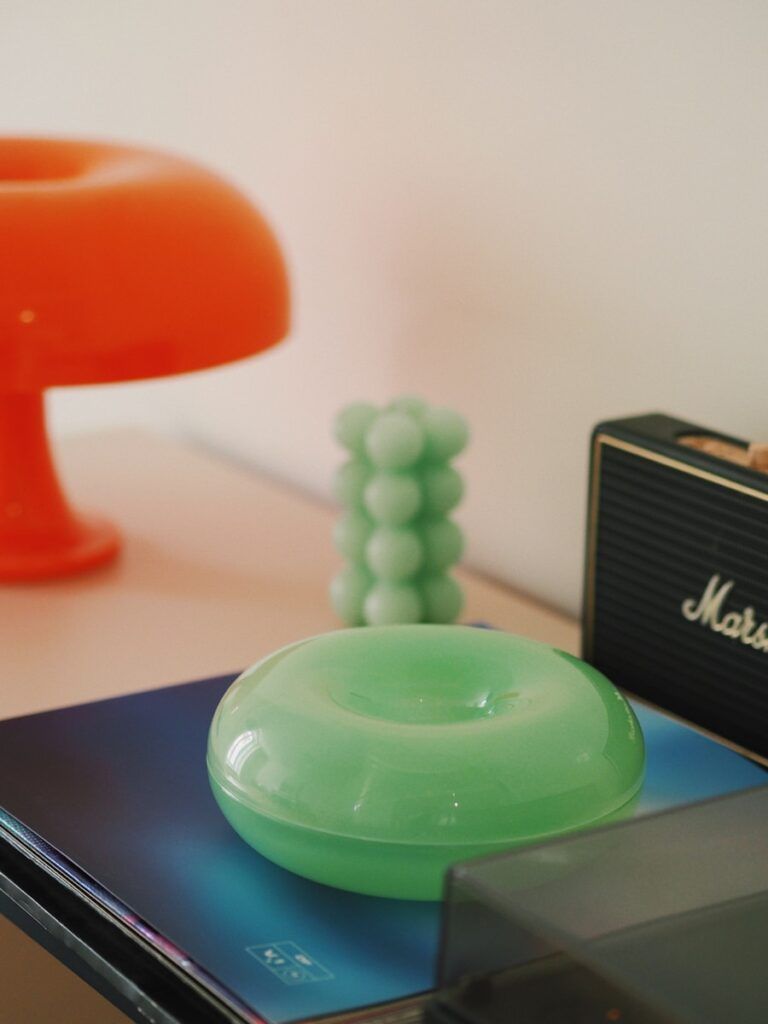 a green object sitting on top of a table