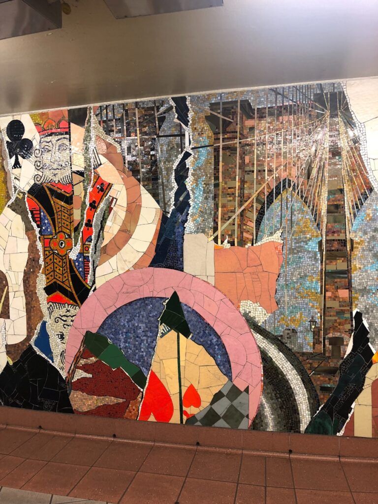 a wall with a mosaic design on it