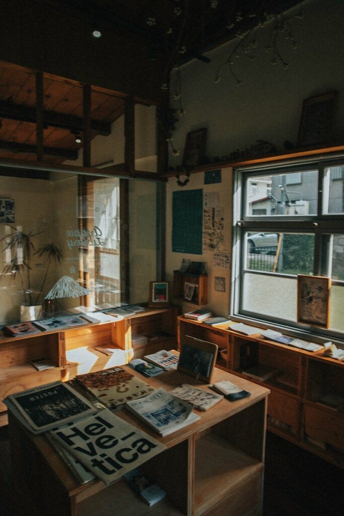 a room filled with lots of clutter next to a window
