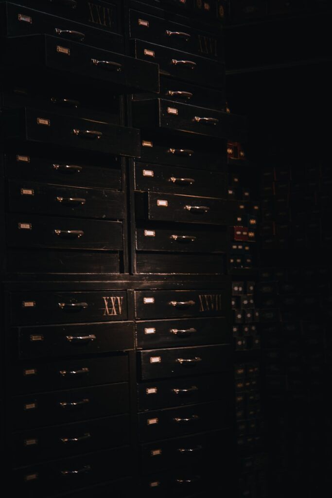 a large stack of drawers in a dark room