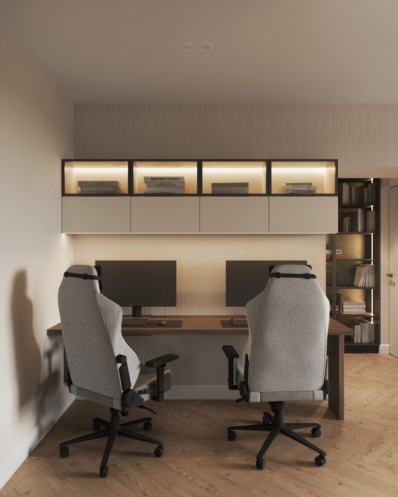 A room with two chairs and a desk