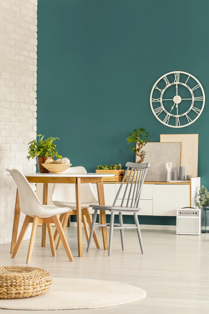 teal accent wall in a dining room