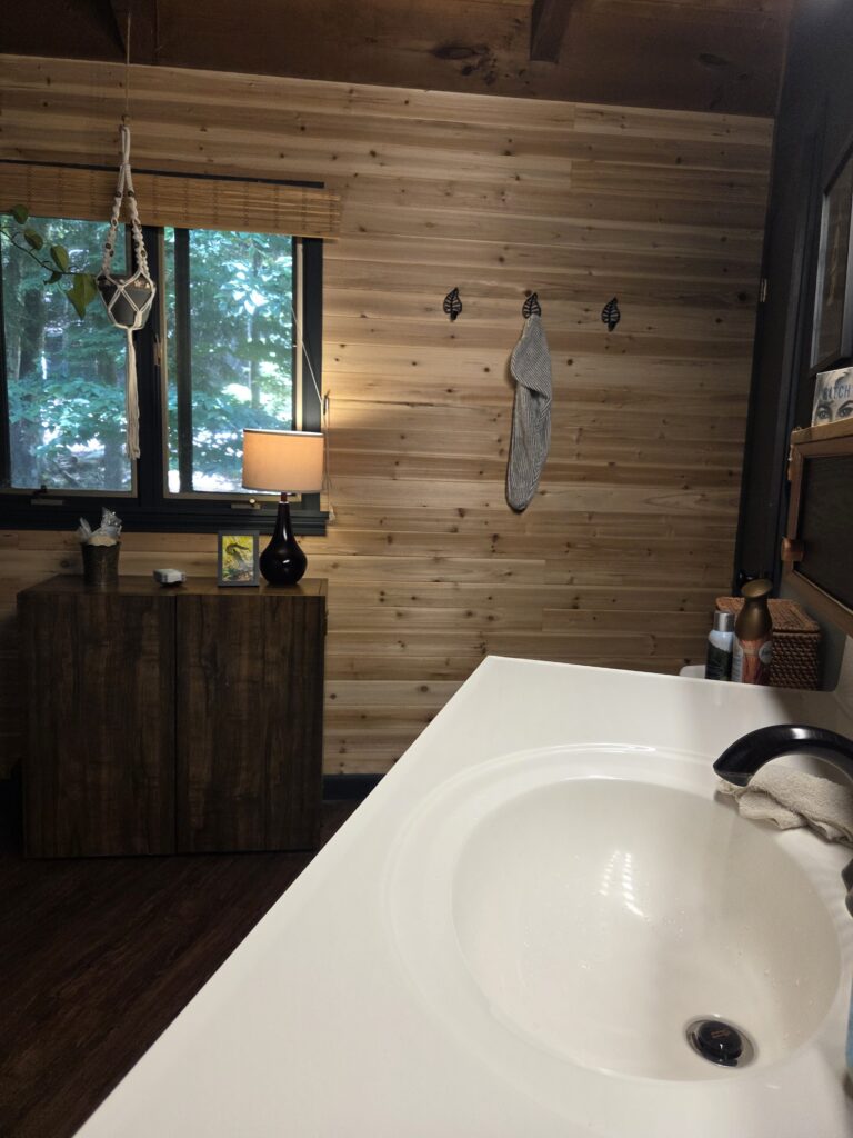 Rustic Wood Accent Wall for a Cozy Cabin Bathroom