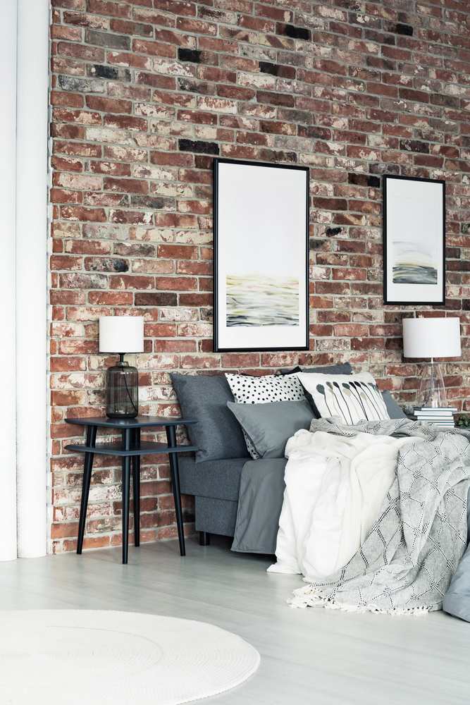 bedroom with brick feature wall