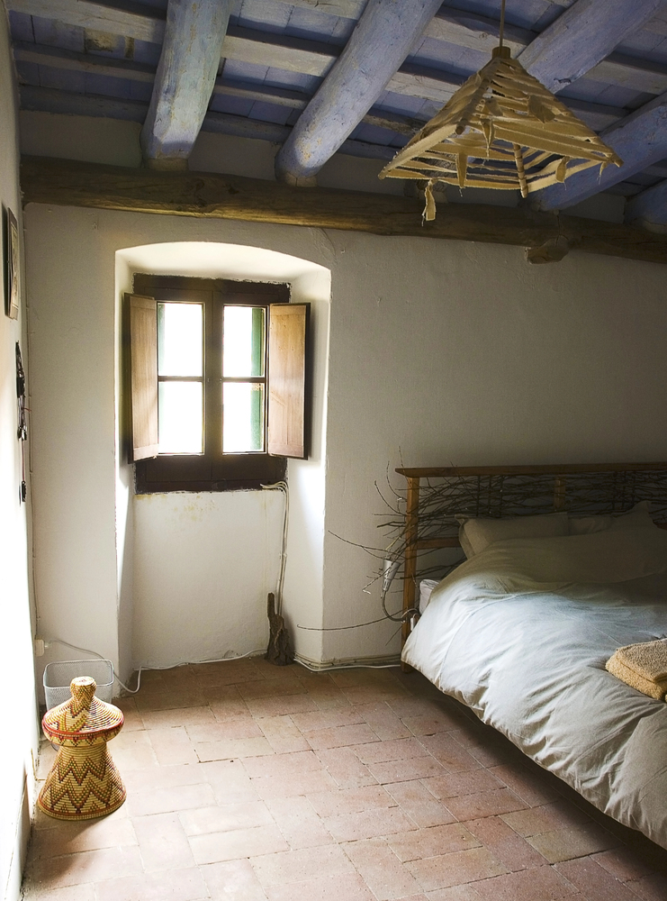 Exposed Wood Beams in a Rustic Bedroom