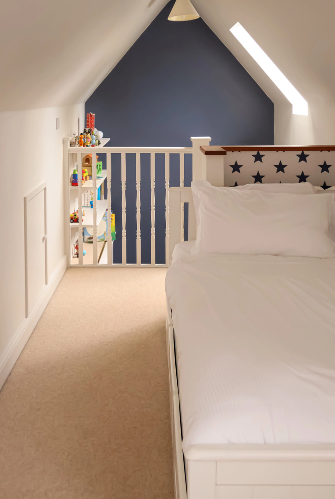 Navy Blue Accent Wall in a Cozy Loft Bedroom