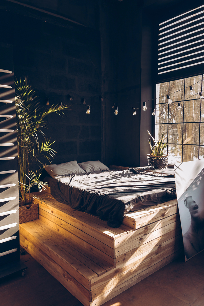 Raw Wood and Dark Walls in a Rustic Bedroom