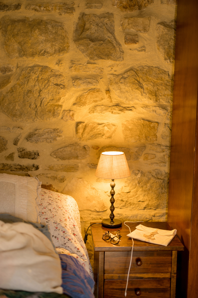 Stone Accent Wall in a Rustic Bedroom
