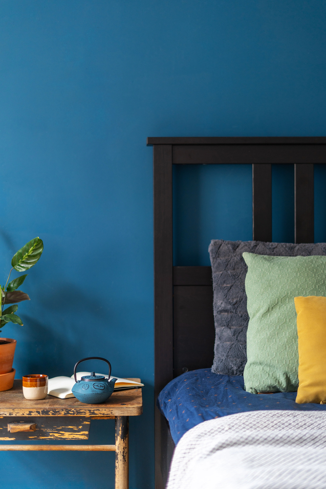 Deep Blue Accent Wall with Rustic Wood Details