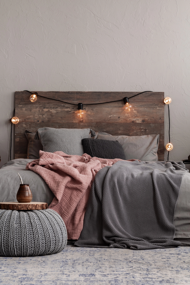 Rustic Bedroom With Cozy Textiles and String Lights
