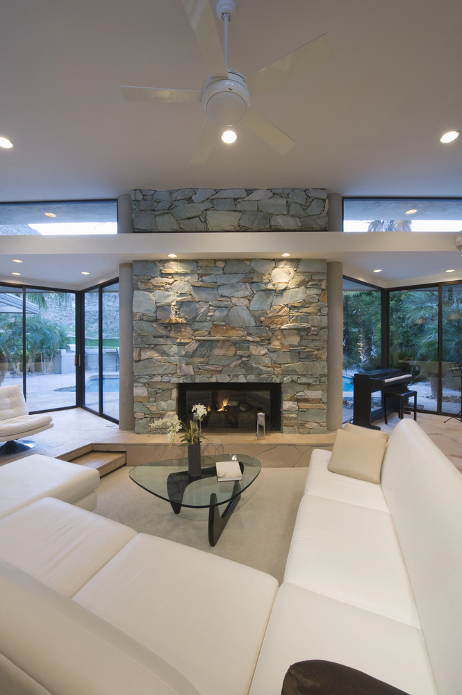 Stone Fireplace With Modern White Seating