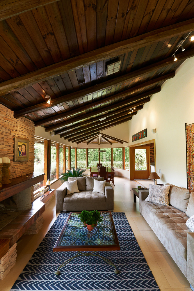 Stone Fireplace and Dark Wood Ceiling